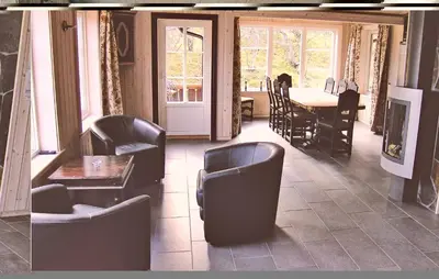 a dining room with chairs and a table and a table and a tableearcher at Holiday Home Hemsedal Høgeloft in Hemsedal