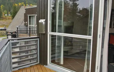 an open balcony with a view of a house at Nice Apartment In Hemsedal With Sauna in Hemsedal