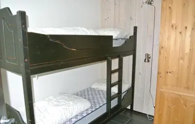 a room with two bunk beds with white sheets at Nice Apartment In Hemsedal With Sauna in Hemsedal