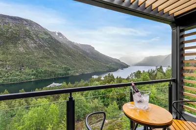 a balcony with a view of a lake and mountains at Sogndal Fjordpanorama - The view in Sogndal