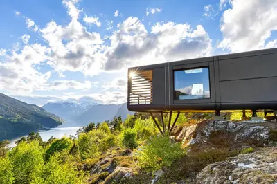 a house on a hill with a view of a lake at Sogndal Fjordpanorama - The view in Sogndal