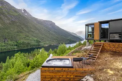 a house with a view of a river and mountains at Sogndal Fjordpanorama - The atmosphere in Sogndal