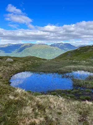 a view of a mountain with two ponds in a field at Hytto in Håra