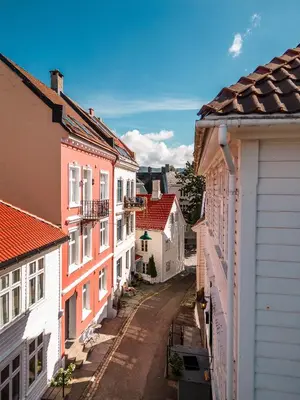 an empty street in a town with buildings at Dragesmauet Apartments in Bergen