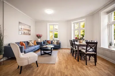 a living room with a couch and a table at Rosen Apartment in Bergen