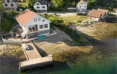 an aerial view of a house on the water at Cozy Home In Vanvik With Wifi in Vanvik