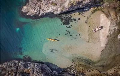 an aerial view of a beach with boats in the water at Cozy Home In Vanvik With Wifi in Vanvik