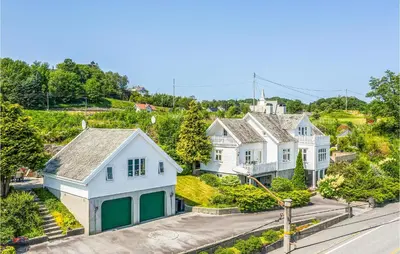 an aerial view of a row of white houses at Amazing Home In Skjoldastraumen in Skjoldastraumen