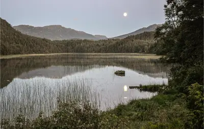 a view of a lake with the moon in the sky at Lovely Home In Bjoa With Kitchen in Utbjoa