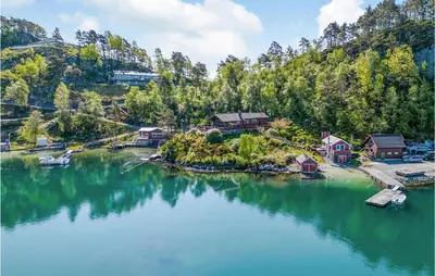 an aerial view of a lake with houses and trees at Cozy Home In Sveio With Wifi in Sveio