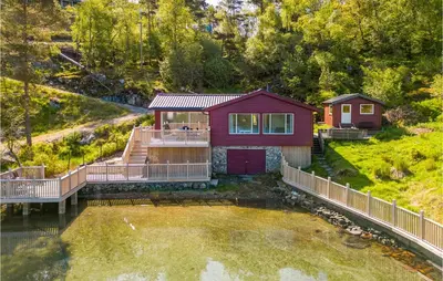 an aerial view of a house with a pond at Cozy Home In Sveio With Wifi in Sveio