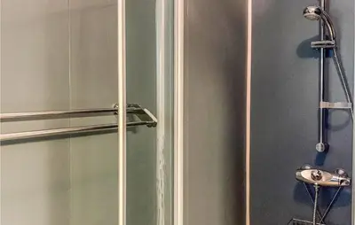 a shower with a glass door in a bathroom at Beautiful Home In Jondal in Jondal
