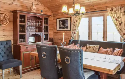 a dining room with a table and chairs at 3 Bedroom Amazing Home In Vossestrand in Vossestrand