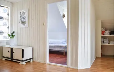 a room with a door leading to a bedroom at Amazing Home In Torangsvåg With Wifi in Skår