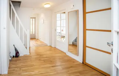 a hallway with white walls and a wooden floor at Cozy Home In Bruvik With Wifi in Bruvik
