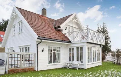 a white house with a conservatory on it at Gorgeous Home In Fjell With Wifi in Lokøy