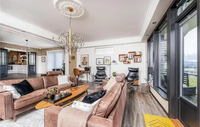 a living room with a couch and a table at Gorgeous Home In Vestnes With Wifi in Vestnes