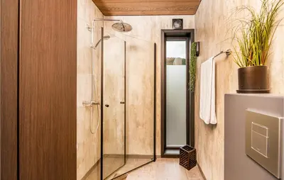 a shower in a bathroom with a glass door at Gorgeous Home In Vestnes With Wifi in Vestnes