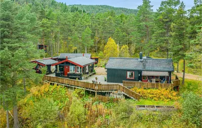 an aerial view of a house in the woods at 2 Bedroom Cozy Home In Øydegard in Nastad