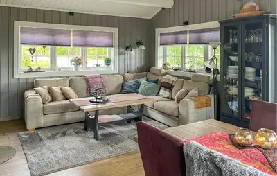a living room with a couch and a table at Pet Friendly Home In Rena With Wifi in Rena