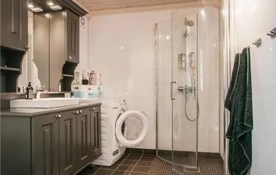 a bathroom with a shower and a toilet and a sink at Beautiful Home In Engerdal With Kitchen in Kvisla
