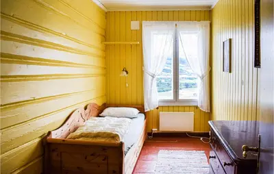 a bedroom with a bed in a room with a window at 10 Bedroom Lovely Home In Østre Gausdal in Vestre Gausdal