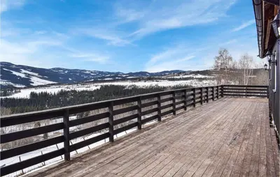 a wooden boardwalk with a view of the mountains at Awesome Home In Nord-Torpa With Kitchen in Nord Torpa