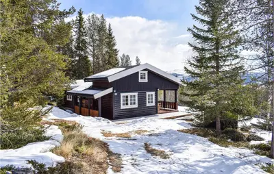 a cabin in the woods in the snow at 4 Bedroom Stunning Home In Vinstra in Vinstra