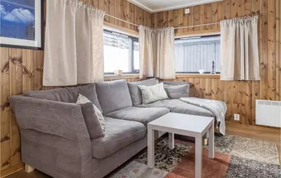a living room with a couch and a table at 4 Bedroom Lovely Home In Øyer in Øyer