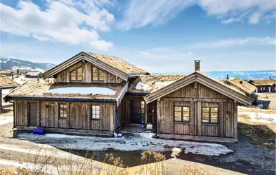 an image of a log home with snow at 4 Bedroom Beautiful Home In Øyer in Øyer