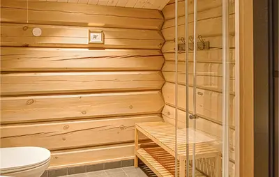 a bathroom with a sauna with a toilet at Beautiful Home In Øyer With Sauna in Øyer