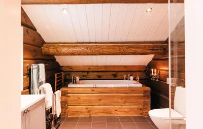 a bathroom with a tub and a toilet at Solbergsætra in Øyer