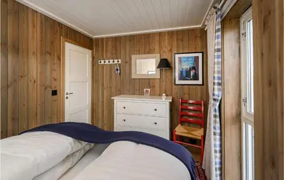 a bedroom with a bed and a desk and a window at Gorgeous Home In Sjusjøen With Kitchen in Sjusjøen