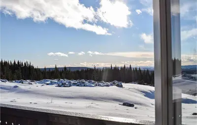 a view of a snow covered field from a window at Amazing Home In Mesnali With Wifi in Mesnali