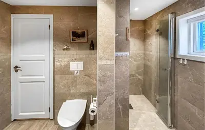 a bathroom with a toilet and a walk in shower at Sjusjøen Pihl 4001 in Sjusjøen