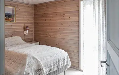 a bedroom with a white bed and a window at 4 Bedroom Beautiful Home In Sjusjøen in Sjusjøen