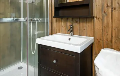 a bathroom with a sink and a shower at 4 Bedroom Gorgeous Home In Sjusjøen in Sjusjøen
