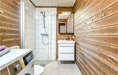a bathroom with a shower and a toilet and a sink at 4 Bedroom Amazing Home In Lillehammer in Lillehammer