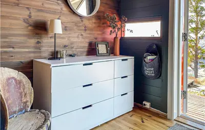 a bedroom with a white dresser and a window at 3 Bedroom Awesome Home In Eggedal in Eggedal