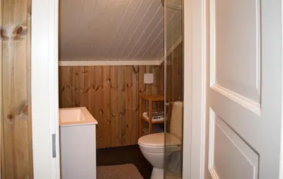 a bathroom with a toilet and a sink at 4 Bedroom Awesome Home In Eggedal in Eggedal