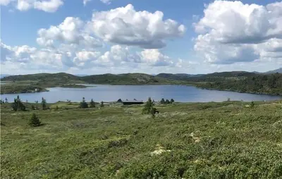a large lake in the middle of a field at 4 Bedroom Awesome Home In Eggedal in Eggedal