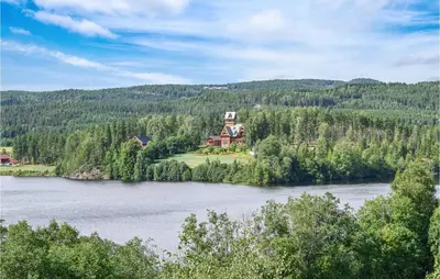 a house on an island in the middle of a river at Bjertnes Turistgård in Noresund
