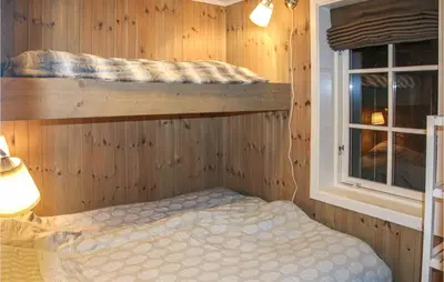 a bedroom with a bunk bed and a window at Beautiful Home In Hovden I Setesdal in Hovden