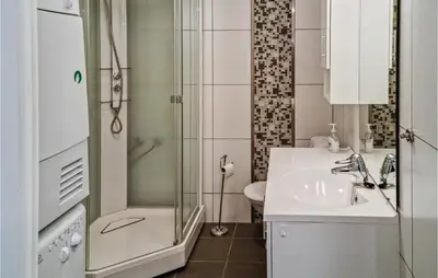 a small bathroom with a sink and a shower at Beautiful Home In Hovden I Setesdal in Hovden