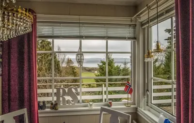 a window with a view of a golf course at Amazing Home In Ytterøy With Wifi