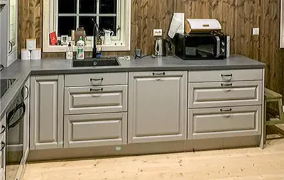 a kitchen with a counter top with a microwave at Nice Home In Beitstad With Kitchen in Sunnan