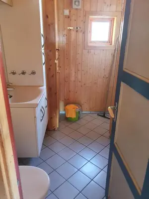 a small bathroom with a toilet and a sink at Bjørklund in Geilo