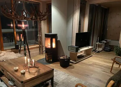 a living room with a coffee table and a tv at Gaustatoppen Lodge - Mountain View - Gaustablikk in Rjukan