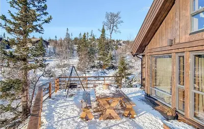 a winter view of a house in the snow at 4 Bedroom Beautiful Home In Rjukan in Rjukan