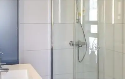 a shower with a glass door in a bathroom at 4 Bedroom Beautiful Home In Rjukan in Rjukan